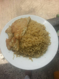 A picture of Buttered Noodles with Fried Egg.