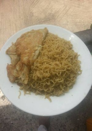 A picture of Buttered Noodles with Fried Egg.