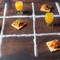 A picture of Biscuit sandwich with orange juice.