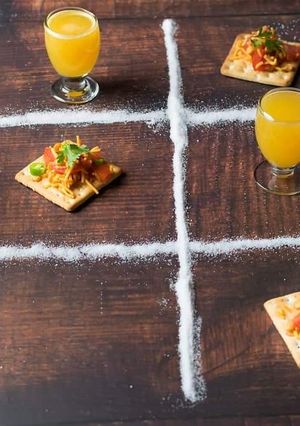 A picture of Biscuit sandwich with orange juice.
