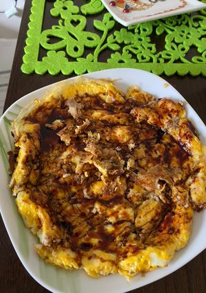 A picture of Eggs with dates syrup for breakfast.
