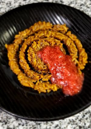 Una foto de Arroz dulce de naranja y azafrán
