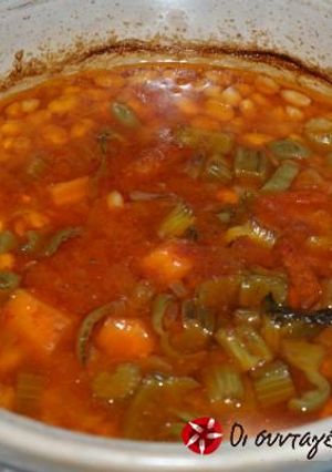 A picture of Bean soup in a clay cooking pot.