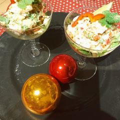 A picture of Festive appetizer: Fish and avocado cocktail.