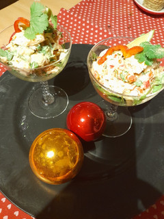 A picture of Festive appetizer: Fish and avocado cocktail.