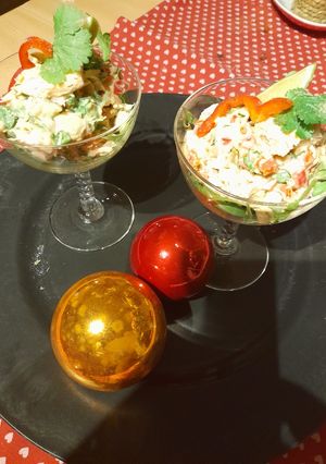 A picture of Festive appetizer: Fish and avocado cocktail.