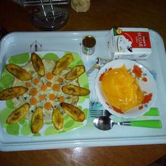 Fried flat eggs and plantain with custard A picture of Fried flat eggs and plantain with custard.