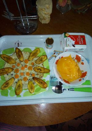 A picture of Fried flat eggs and plantain with custard.
