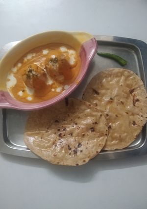 A picture of Malai Kofta in Orange🟠 Gravy.