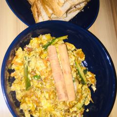 A picture of Grilled bread and scrambled eggs.