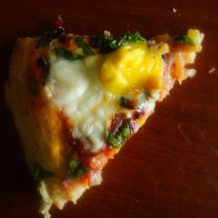 Quail Egg and Beet Leaves Wholewheat Pizza A picture of Quail Egg and Beet Leaves Wholewheat Pizza.