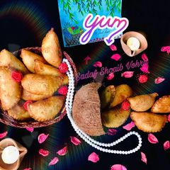 A picture of Meethay samosay  /Gujiya /Sweet (honey) half moon.