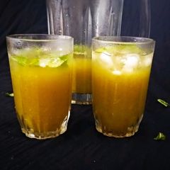 A picture of Aam Panna with Jaggery.