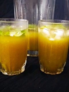 A picture of Aam Panna with Jaggery.