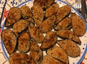 Una foto di cozze gratinate