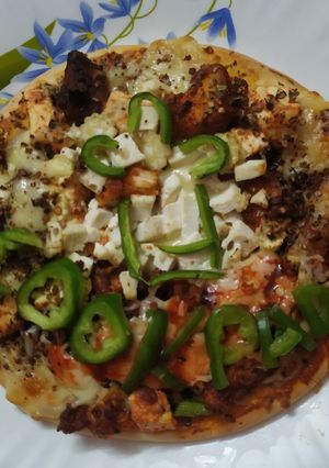 A picture of Pizza with edible cookpad hat.