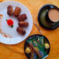 A picture of Gola Kabab with Tea & Snacks.