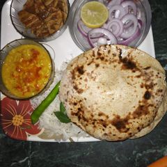 A picture of चने की रोटी दाल तडका के साथ.