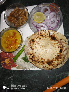 A picture of चने की रोटी दाल तडका के साथ.