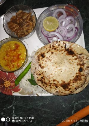 A picture of चने की रोटी दाल तडका के साथ.