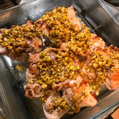 A picture of Chicken thighs with pistachio crust.