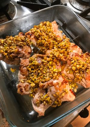 A picture of Chicken thighs with pistachio crust.