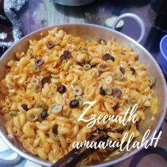 A picture of Olives Loaded Cheesy Desi Style Macaroni.