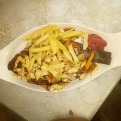 Tilapia fish serve with chip A picture of Tilapia fish serve with chip.