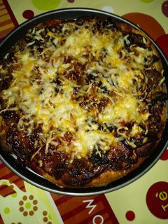 Una foto de Pizza de kebab picantón, queso de rulo de cabra y champiñones al natural