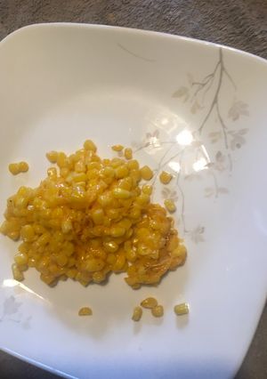 A picture of Sautéed corn with cheddar.
