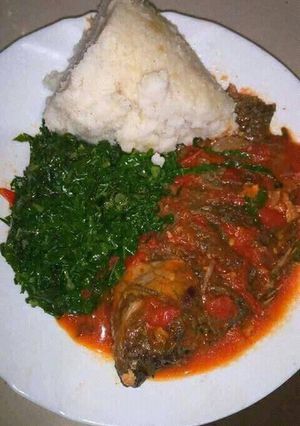 A picture of Wet fly fish with sukuma and ugali.