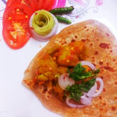 Aloogobhi with triangle prantha A picture of Aloogobhi with triangle prantha.
