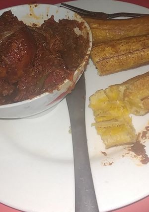 A picture of Fried Banana With Wet Fry Beef Stew.