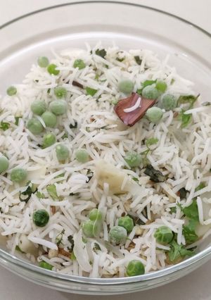 A picture of Onion Green Peas Pulao with leftover Rice.