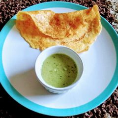 A picture of Orange dosa/Carrot dosa.