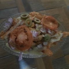 A picture of Potato 🥔 chips 🍟 with cheese 🧀.