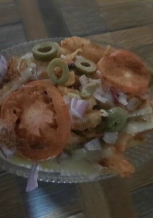 A picture of Potato 🥔 chips 🍟 with cheese 🧀.
