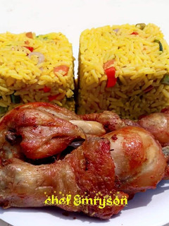 A picture of Turmeric fried rice and fried chicken.
