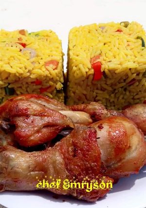 A picture of Turmeric fried rice and fried chicken.