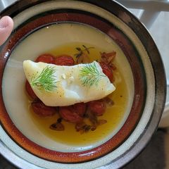 A picture of Sous Vide Chilean Seabass fish with Tomato Confit (inspired by the bear).