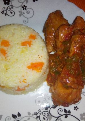 A picture of Carrot pineapple rice with wet fried chicken.