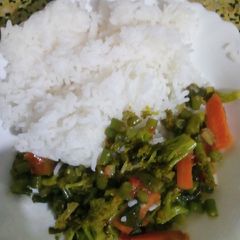 Fried vegetables served with rice A picture of Fried vegetables served with rice.