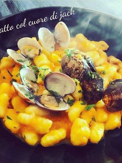 A picture of Gnocchi with Clams and Pumpkin Cream.