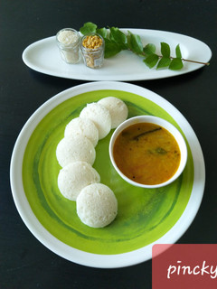 A picture of Idli with sambhar.
