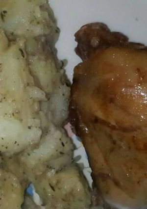 A picture of Garlic potatoes and grilled chicken.