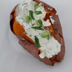A picture of My Sweet Potato with soft cheese, chives + Spring onion Filling❤.