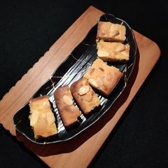 A picture of Orange dry fruit cake.