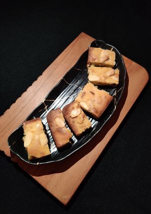 A picture of Orange dry fruit cake.