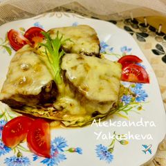 A picture of Tuna (fillet), baked on cabbage steaks, with cheese.