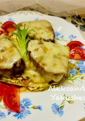 A picture of Tuna (fillet), baked on cabbage steaks, with cheese.